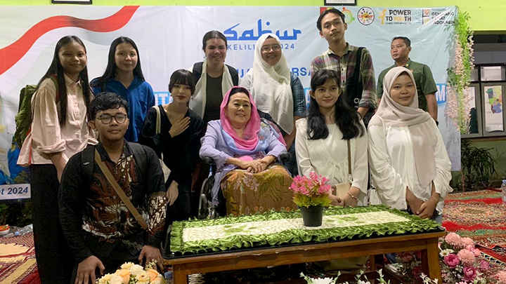 team members with former First Lady of Indonesia