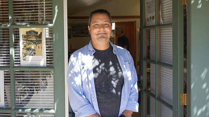 Isaac Ullah in open door of the La Mesa History Center