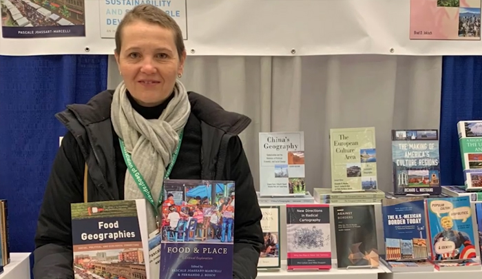 Pascale holds books