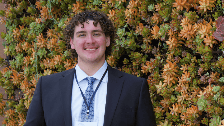 Ethan Pellegrinii on the second floor of the Conrad Prebys Aztec Student Union after his presentation at the SDSU Student Symposium in May. (L