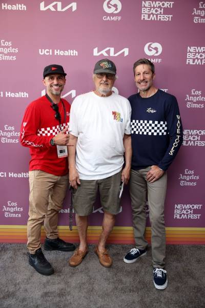 three men at film premiere