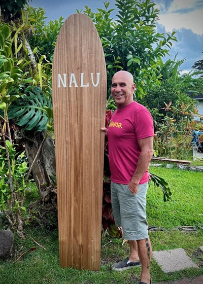 man holding surfboard