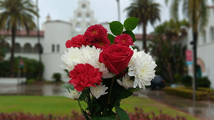 bouquet of flowers in front of Hepner Hall